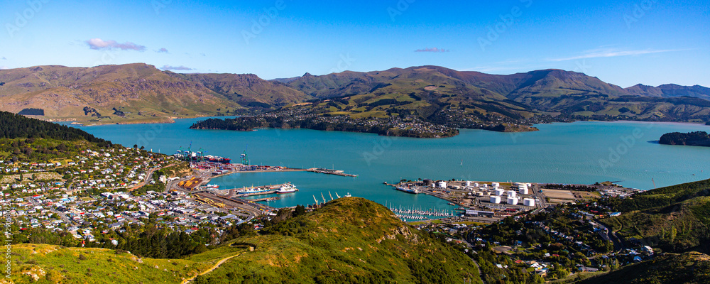 Fototapeta premium panorama of farmous lyttelton harbor and banks peninsula seen from the bridle path near gondola summit, christchurch, canterbury, new zealand south island