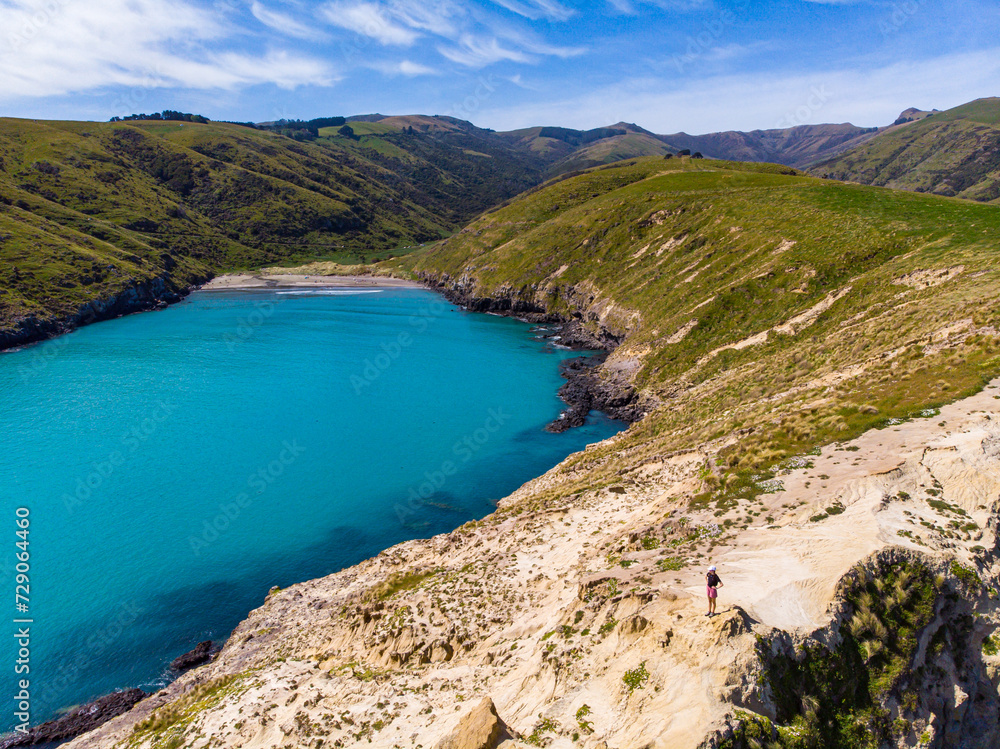 aerial panorama of tumbledown bay, banks peninsula near christchurch, canterbury, new zealand south island