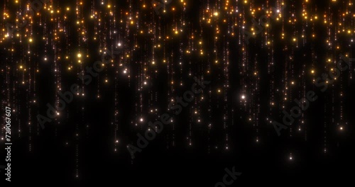 An orange curtain of sparkling lights. Orange, yellow, white particles with tails of scattered small particles falling down on a black background. Seamless looping animation.