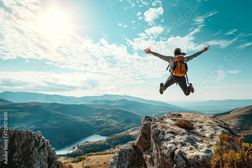Happy man with backpack jumping on top of the mountain - Delightful hiker with arms up standing over the cliff - Sport and travel life style concept, Generative AI