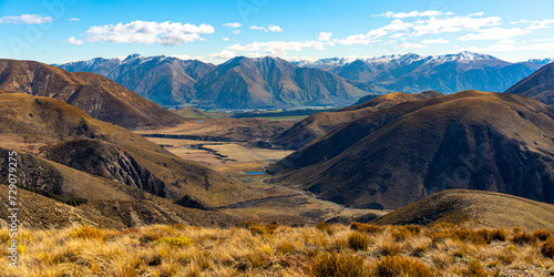 panorama of mountains in torlesse tussocklands national park, canterbury, new zealand south island; trail to trig m with panorama of alps and lake lyndon