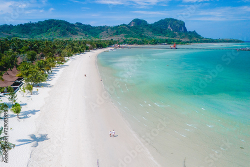 Koh Mook Drone view at a couple walking on the white sandy tropical beach of Koh MukThailand