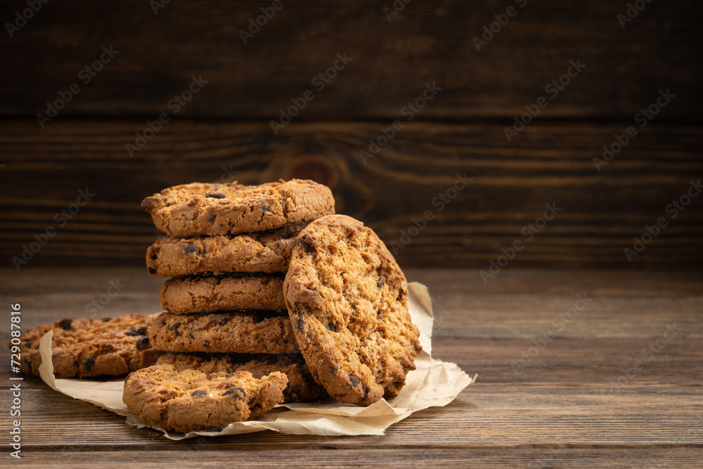 Chocolate cookies on a wooden table. Chocolate cookies on a wooden table.