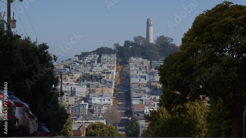 The Crooked Lombard Street with Coit Tower Visible in the Distance in San Francisco, California - Wide Shot