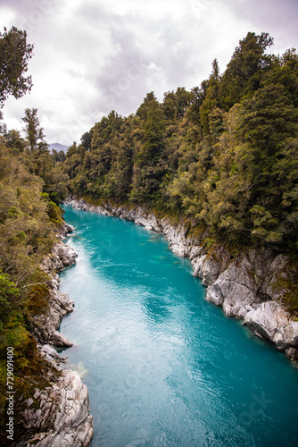 panorama of famous hokitika gorge in new zealand south island, west coast; unique river with blue water from glacier in new zealand alps
