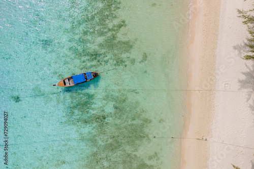 Top view at longtail boats in a blue ocean at the beach of Koh Ngai island Thailand © Fokke Baarssen