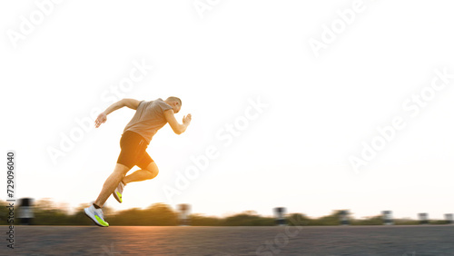 The man with runner on the street be running for exercise. Sport Backgrounds, Male runner ready for sports exercise, Athlete running on athletic track. Athlete runner feet running on road