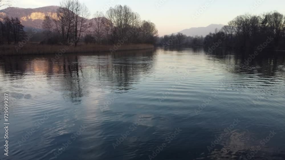 Aerial view of Adda river in Lombardy, Italy at sunset Aerial view of Adda river in Lombardy, Italy at sunset
