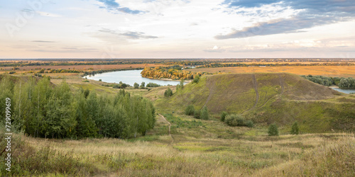 View of a hilly area with a river, evening landscape, autumn nature