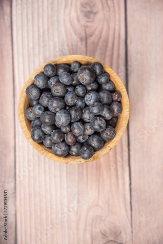 blueberries in a wooden bowl,blueberries in a wooden bowl on a wooden background, healthy food, fruit in a bowl