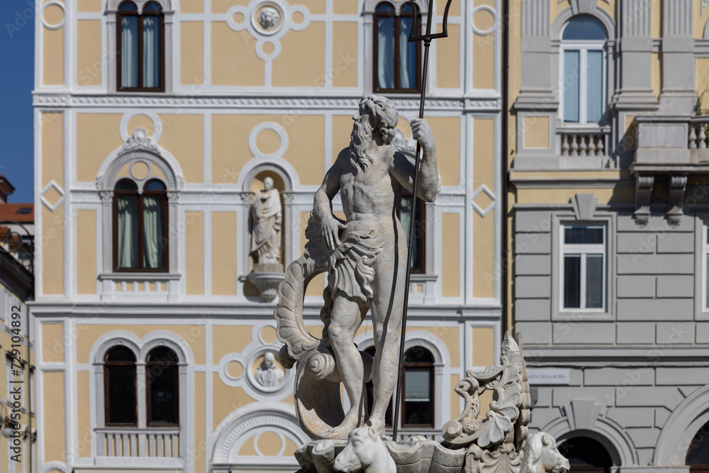 Obraz premium Fountain of Neptune located on Stock Exchange Square (Piazza della Borsa), Trieste, Italy
