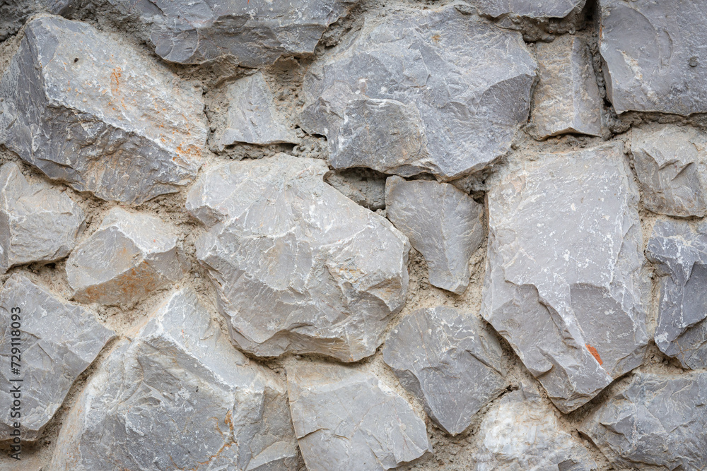 Background of stone wall texture or rock wall background for interior exterior decoration and industrial construction concept design. Background of stone wall texture or rock wall background for interior exterior decoration and industrial construction concept design.