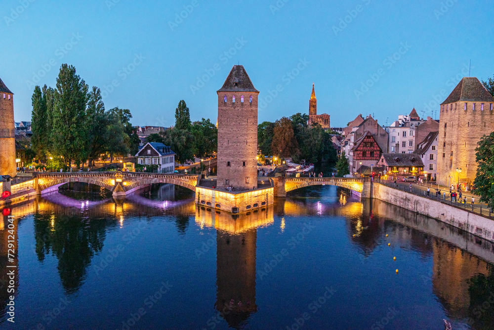 Fototapeta premium Panoramic view on The Ponts Couverts in evening twilight. Strasbourg with blue cloudy sky. France.