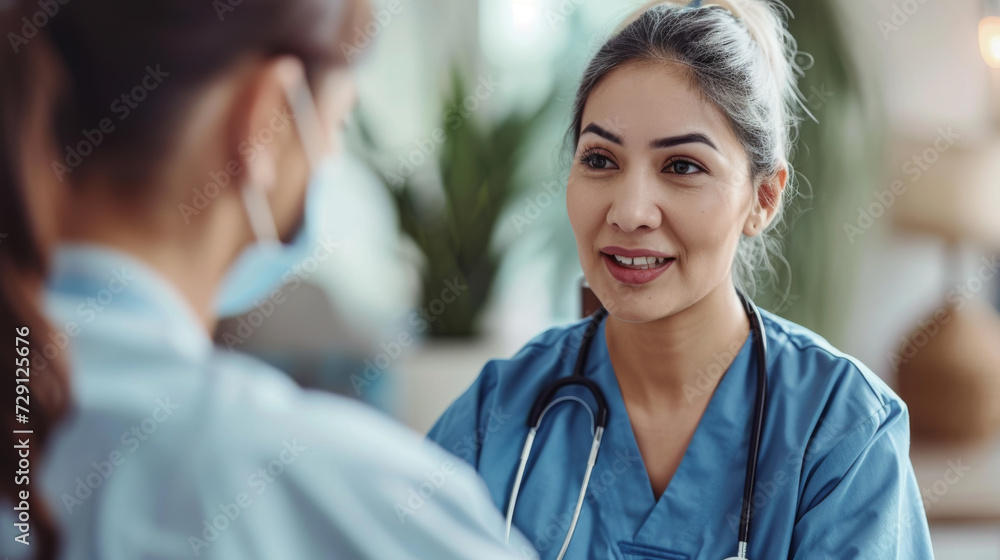 focused female doctor in a white coat with a stethoscope around her neck using a tablet while consulting with a patient or colleague focused female doctor in a white coat with a stethoscope around her neck using a tablet while consulting with a patient or colleague