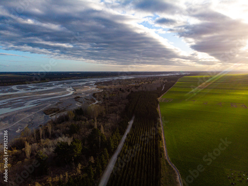 aerial panorama of waimakariri river near christchurch, north canterbury, new zealand; sunset over beautiful river photo