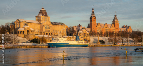 The historic buildings of Haken Terrace in Szczecin reflected in river