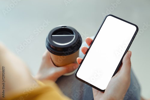 Hand holding smartphone mockup of blank screen, Take your screen to put on advertising.