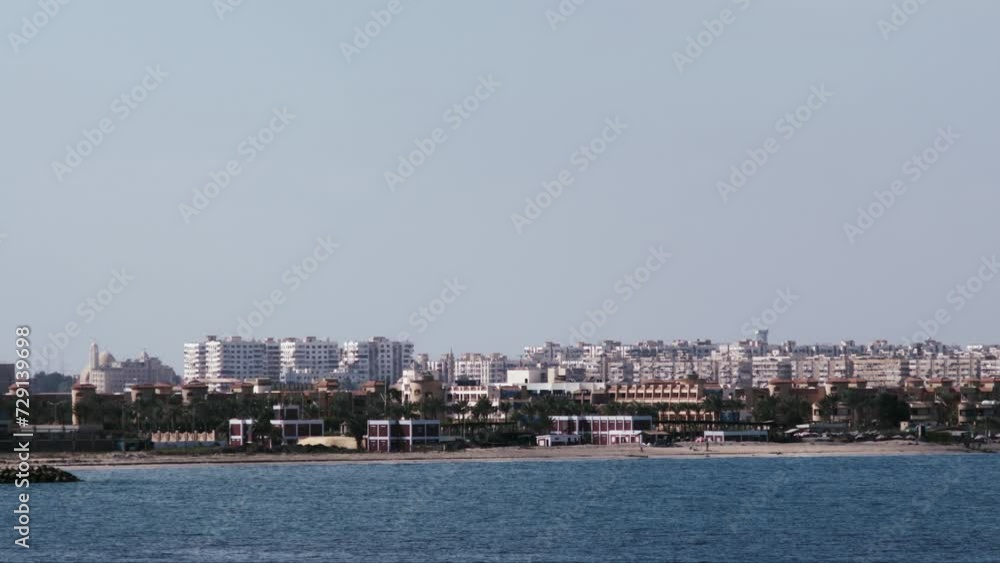 Entrance of Suez Canal with the buildings of Port Said in the background seen from a vessel. Entrance of Suez Canal with the buildings of Port Said in the background seen from a vessel.