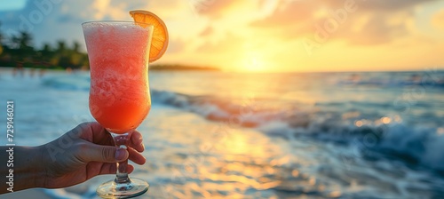 Savoring a lava flow cocktail on a paradise beach on a warm, sunny day with space for text. photo