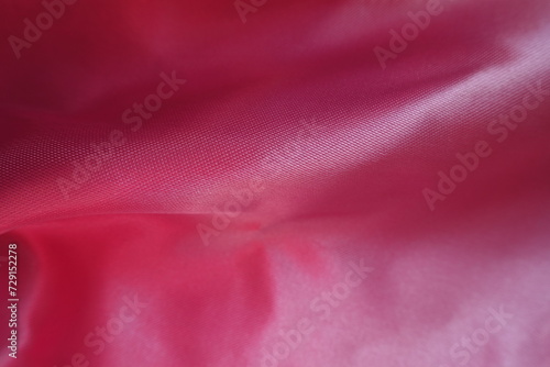 Rumpled smooth cold pink satin polyester fabric