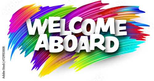 Welcome aboard paper word sign with colorful spectrum paint brush strokes over white.