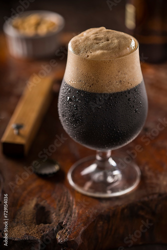 Stout Beer. Glass of cold dark beer. photo