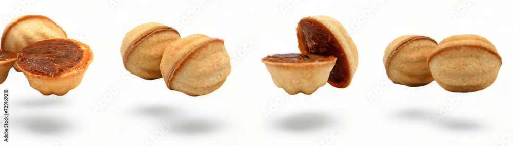 Banner with fresh and delicious cookies in the shape of a walnut with boiled condensed milk on a white background. A favorite delicacy for children and adults with a delicate filling inside. Banner with fresh and delicious cookies in the shape of a walnut with boiled condensed milk on a white background. A favorite delicacy for children and adults with a delicate filling inside.
