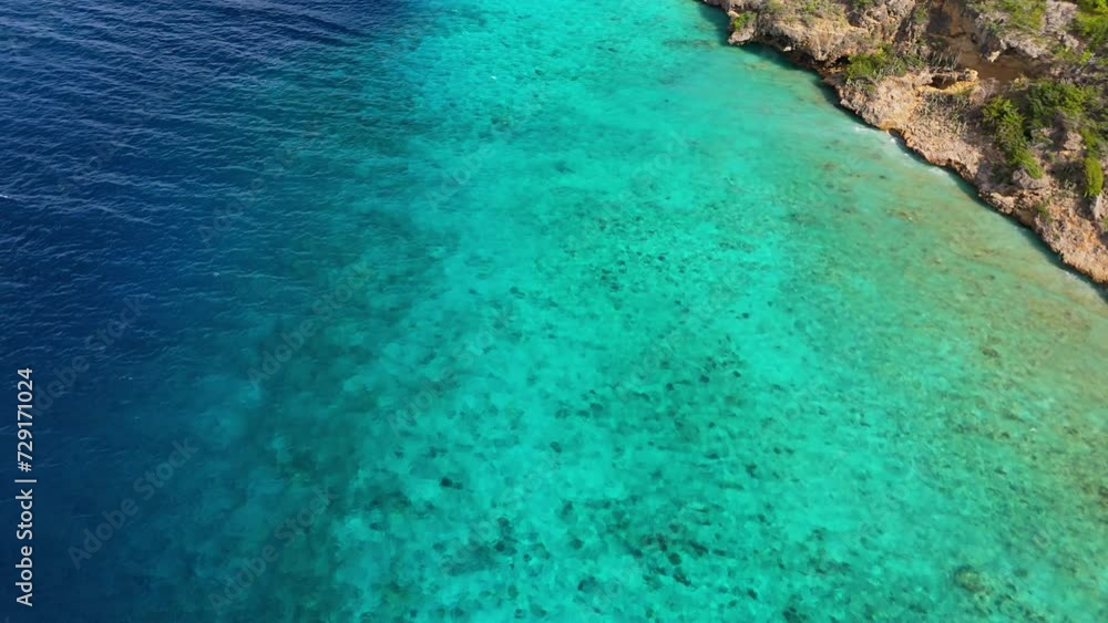Aerial top down of ocean drop off from overhanging tropical cliff Aerial top down of ocean drop off from overhanging tropical cliff