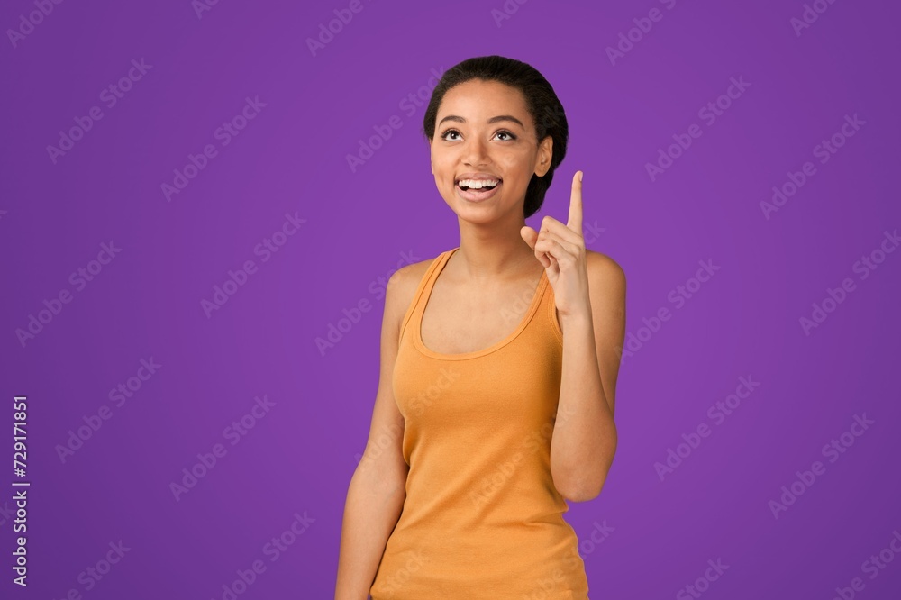 Young woman teacher posing on background