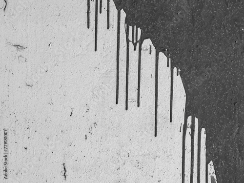 Wall texture with smudges of paint. Black and white monochrome background for design.