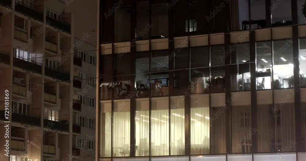 Glowing Windows lights off. Warm glow emanating from windows. Timeless beauty, creating captivating ambiance. Office building in the night city. End of work saving electricity. Glowing Windows lights off. Warm glow emanating from windows. Timeless beauty, creating captivating ambiance. Office building in the night city. End of work saving electricity.