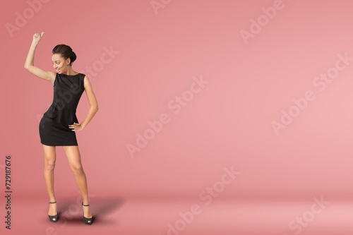 Full body young woman posing on background