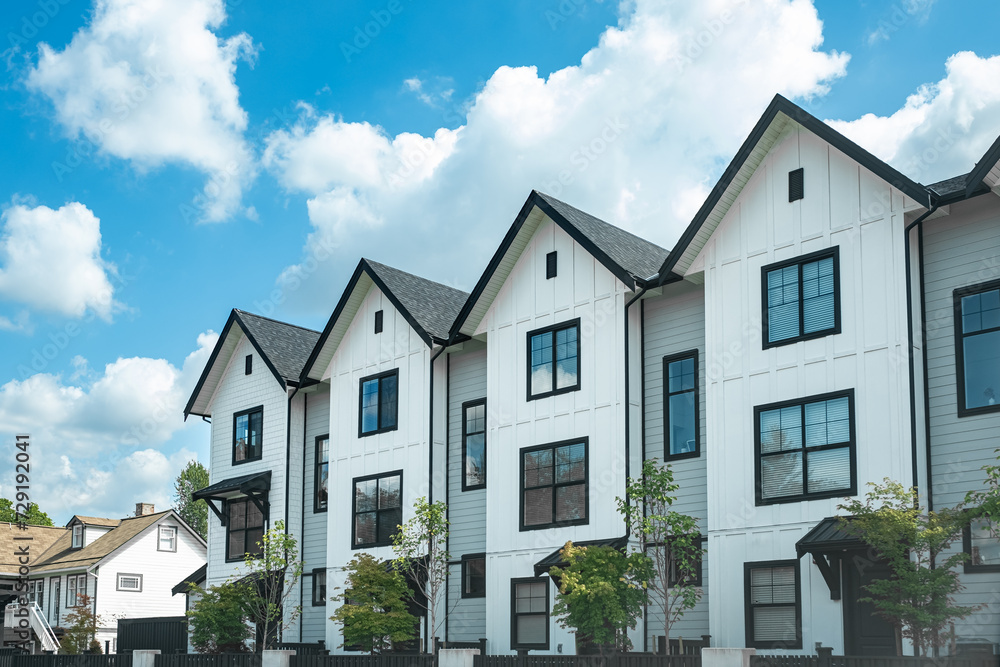 Fototapeta premium Brand new apartment building on sunny day in BC, Canada. Canadian modern residential architecture