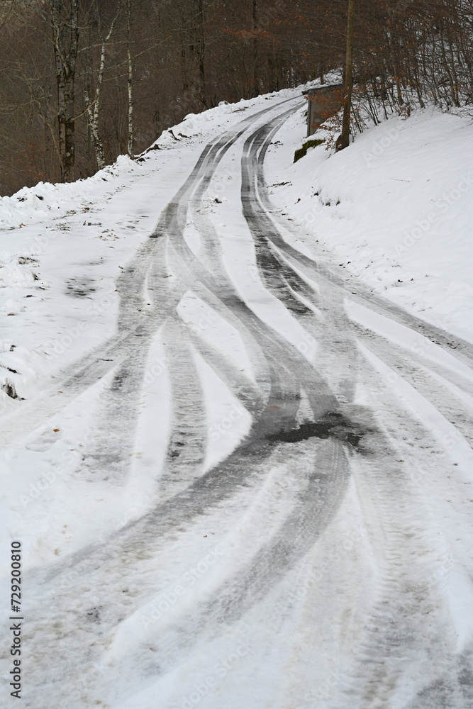 traces of ice on a road in winter traces of ice on a road in winter