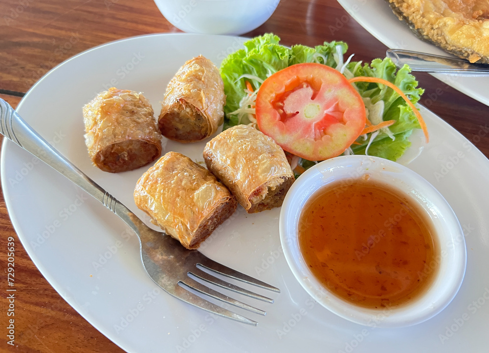 chopped crispy deep fried Tofu Skin Rolls With Crab meat, called in thai as Hoi Jo Pu served with Sweet and Sour Plum Sauce chopped crispy deep fried Tofu Skin Rolls With Crab meat, called in thai as Hoi Jo Pu served with Sweet and Sour Plum Sauce
