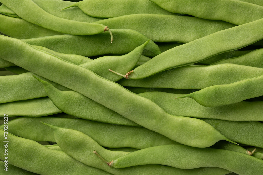 Fresh raw green flat beans full frame close up as background Fresh raw green flat beans full frame close up as background