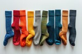 Six pairs of colorful socks lined up in a neat row. Perfect for fashion, clothing, or accessories concepts