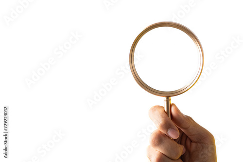 Hand holding magnifier tool isolated on white background. discover and research concept.