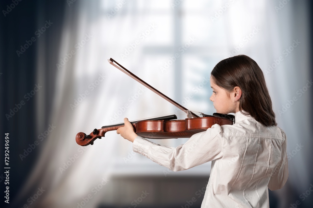 Cute child girl playing violin music instrument Cute child girl playing violin music instrument