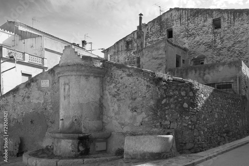 a black and white photo of a well