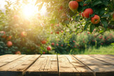 Empty wooden flooring on a blurred background of an apple orchard. display your product outdoors. mockup.