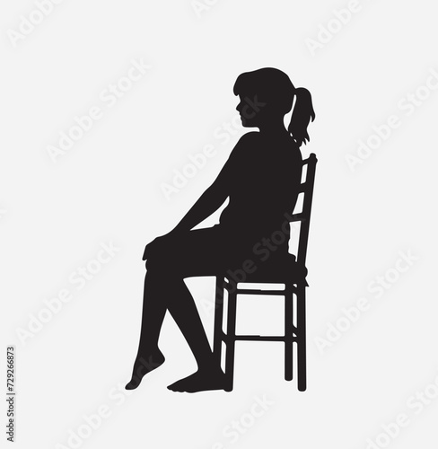 Silhouette of a person sitting on a chair