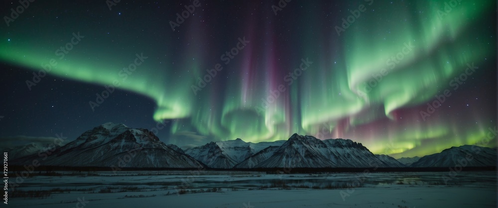 Aurora borealis, northern lights over the mountains in winter