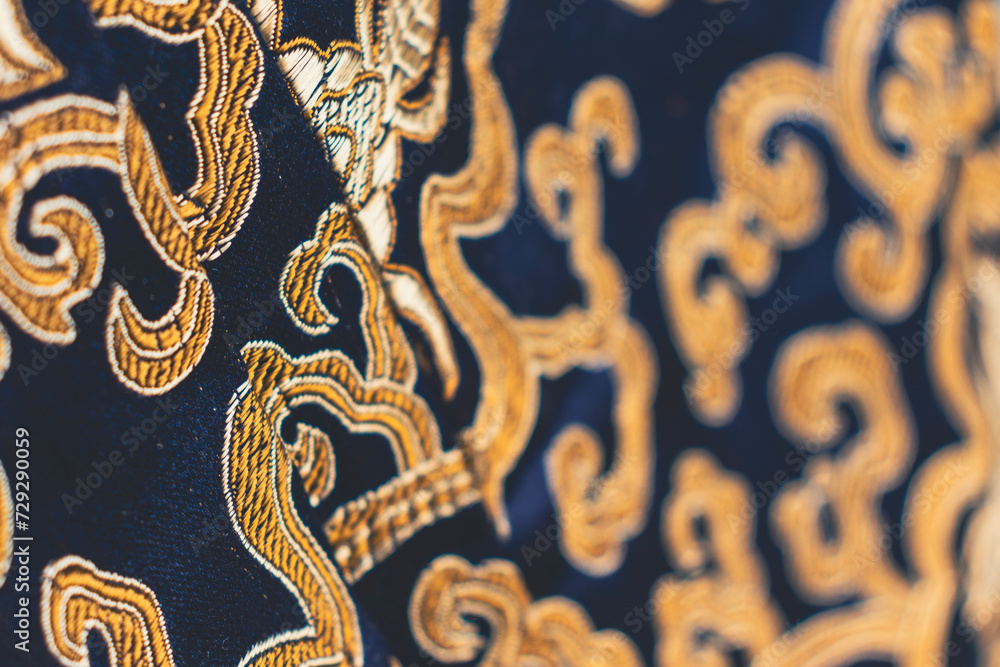 Close up of a deep blue and gold brocade fabric. Copy space Close up of a deep blue and gold brocade fabric. Copy space