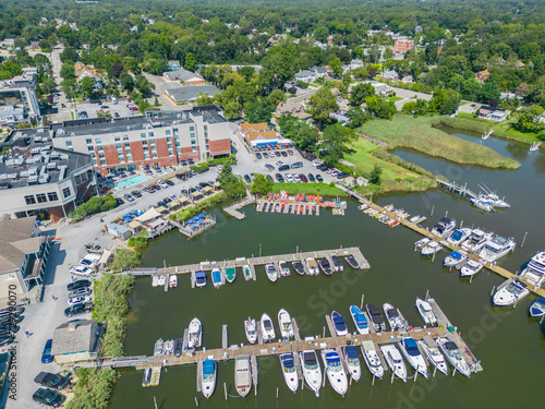 Aerial overhead view of the town of Riverhead New York located in Suffolk County on Long Island with buildings, waterway and boats photo