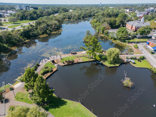 Aerial overhead view of the town of Riverhead New York located in Suffolk County on Long Island with buildings, waterway and boats