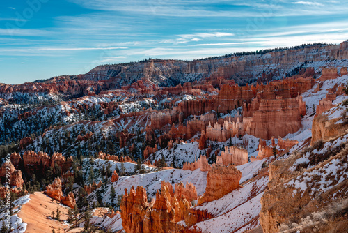 Bryce canyon national park in winter, unique rock formations in utah covered in snow, orange rocks in snow, cold winter in the usa