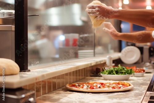chef handtossing dough in the air behind a pizza counter photo