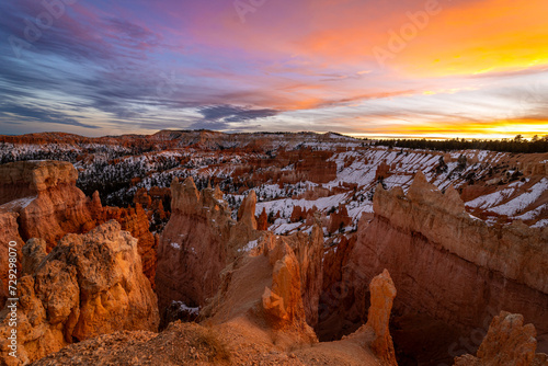 Sunset Bryce canyon national park in winter  unique rock formations in utah covered in snow  orange rocks in snow  cold winter in the usa