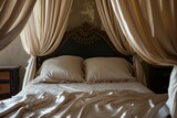 elegantly draped canopy over a bed with satin bedding